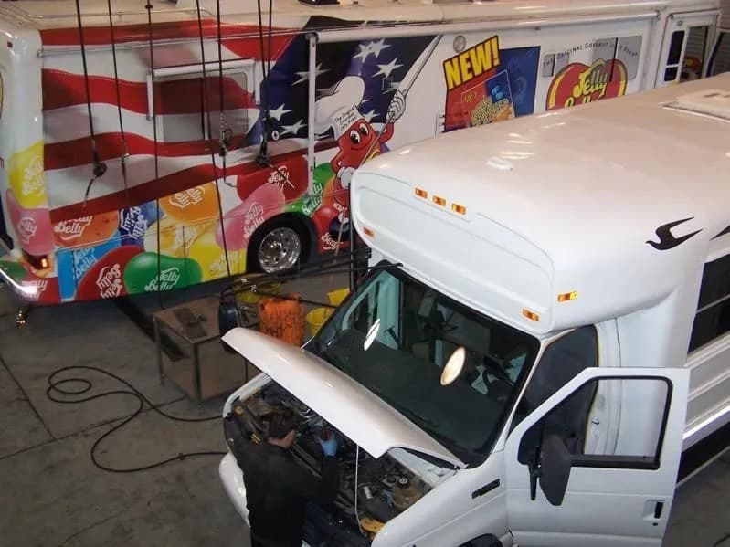 Mobile diesel service van outside open North Bay Truck Center bays