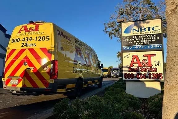 Class A diesel motorhome chassis backed into a daylight Fairfield shop bay